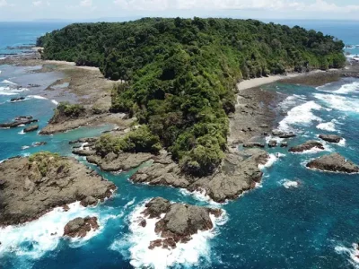 Caño Island can be seen from a distance, showcasing its pristine natural beauty